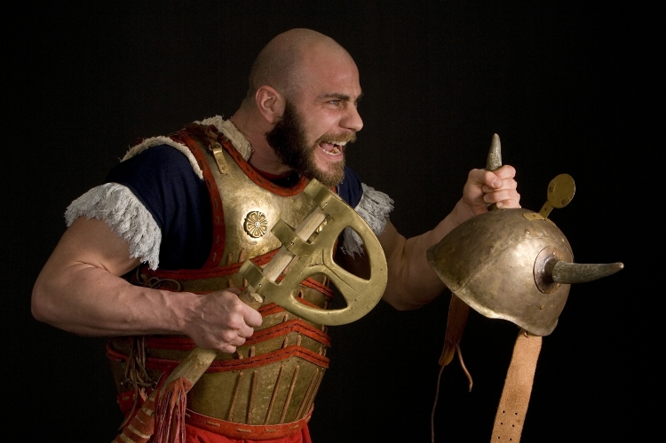 The image depict exactly the moment that the Warrior is engaged in a hand2hand fight and uses the upper part of the axe head to deliver devastating hits to the upper body / head of the opponent. Also it depict the overlapping placement of the cuirass elements, the leather suspension of the plates and the additional linen padding bellow the plates. Association of Historical Studies KORYVANTES. Photo: Andreas Smaragdis