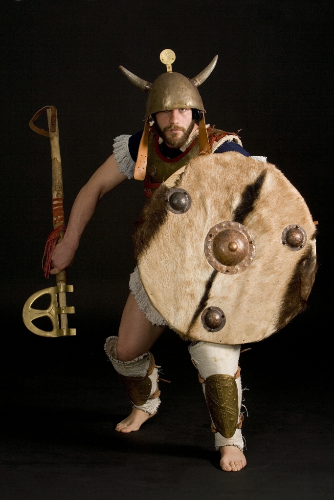 Sea People warrior, armed with heavy Mycaenean Epsilon-type axe. Reconstruction by Hellenicarmors, of a Sea People Armour and weapons, of the Dark ages. The cuirass is based on depiction from Medinet Habu, Mortuary Temple of Ramesses III, Luxor. Heavy, Epsilon-type axe and grieves are based on various Mycaenean artifacts of Greek Archeological Museums. Association of Historical Studies KORYVANTES. Photo: Andreas Smaragdis