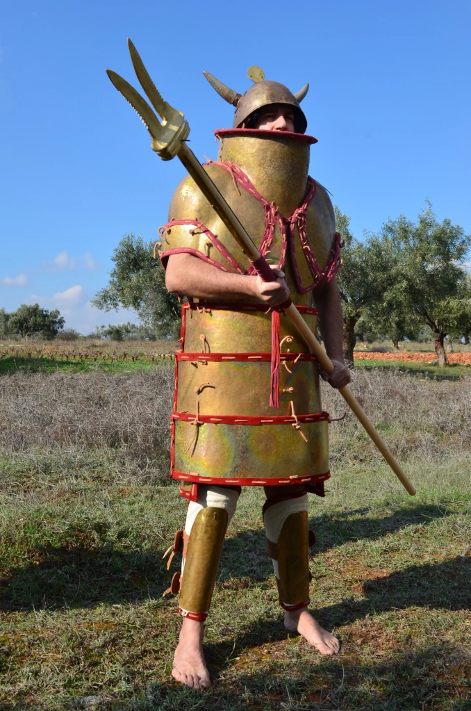 Early Mycaenean warrior, armed with Naumahon Xisto (?) - boarding pike (Ιλ. Ο. 388 - 389, 676 - 78). Reconstruction by Hellenicarmors, of a Mycaenean armor and weapons. The Mycaenean plate armor is an exact copy (onlly scale is different to fit to 1.85 tall man) of the Dendra armor, presented in Nafplion Archeological Museum. The peculiar bronze double-headed blade is dated around 16th Century BC found at Agios Onoufrios near Phaistos Crete. A reference about this kind of double-head spear and its utilization related with the boats is also present in the Iliad during the battle inside the Achaeans camp just around the ships (Iliad XV, 712). The helmet is based on depiction from Medinet Habu, Mortuary Temple of Ramesses III, Luxor. Association of Historical Studies KORYVANTES